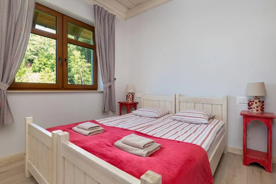 Bedroom with red bedspread