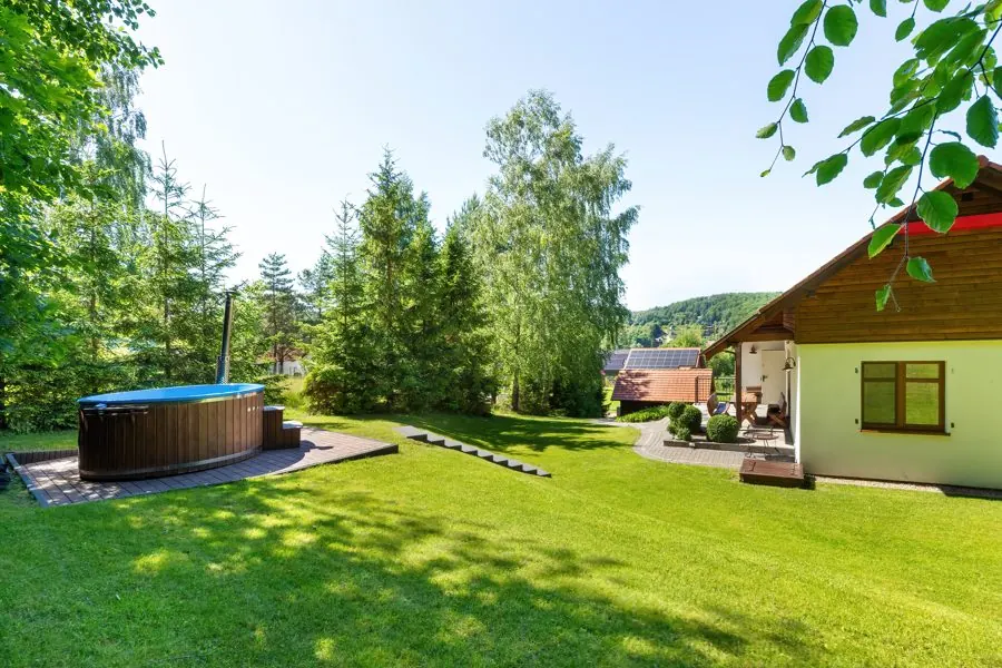 House and hot tub on the lawn